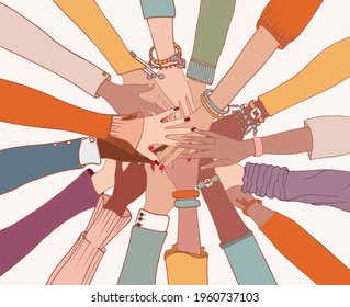 Group of arms and hands on top of each other in a circle of diverse multi-ethnic people.People of different cultures.Cooperation.Agreement between colleagues.Diversity people.Community