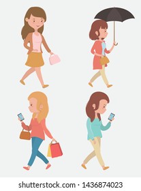 group of beautiful women walking using smartphones