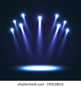 Group of blue bright projectors for scene lighting decoration on black background. Special vector light effects