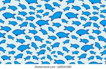 A group of blue fish in the water. Underwater view