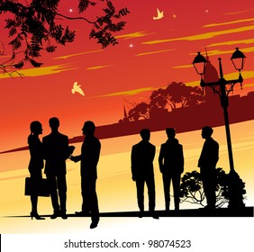 Group of business people in the area at sunset