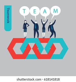A group of businessmen and businesswomen standing on some hexagons