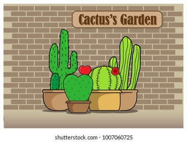 Group of cactus and "Cactus's Garden" wording on brown label front of brick wall background.