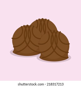 a group of candies with chocolate cream on a pink background
