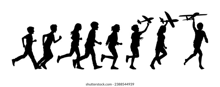 Group of children running with holding toy airplanes vector silhouettes. Kids playing having fun together outside silhouette.	