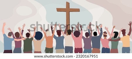 Group of Christians seen from behind with hands raised towards the crucifix praying or singing.Christianity in the world.Christian worship.Concept of faith and hope in Jesus Christ
