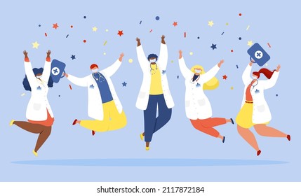 A group of doctors in white coats and protective masks jumps and celebrates against the background of confetti.