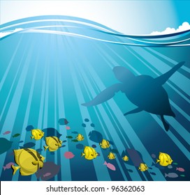 Group of fish and silhouettes of turtle on a sun rays in a sea