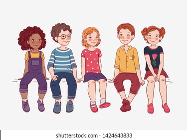 Group of friendly kids sitting on bench. Happy boys and girls