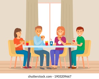 A group of friends eating together in a fast food restaurant having dinner. Happy people are sitting, talking and eating burgers, fries and drinking soda. Young cheerful and smiling men and women