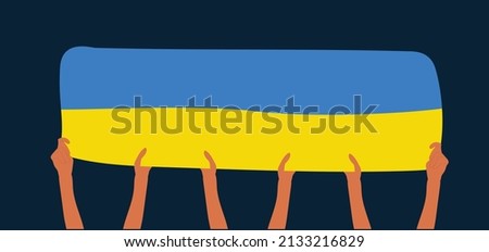 Group of hands holding an Ukraine flag. 