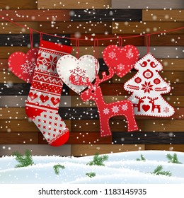 Group of hanging Christmas decorations in Scandinavian style in front of wooden wall, includes hearts, deer, tree and Santa's stocking, vector illustration, eps 10 with transparency and gradient