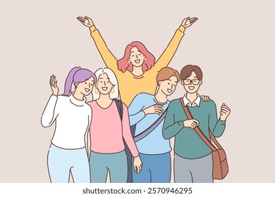 Group of happy students happily pose for group portrait after finishing lecture at university. Positive students smiling and waving enjoying carefree adolescence and free time for friends