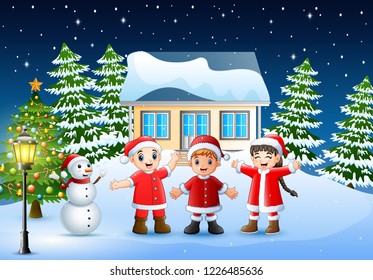 Group of kids in red santa costume joyful and laughing in the snowy village