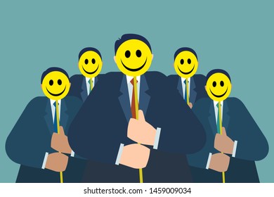 Group of men hold yellow smiling masks to cover their faces