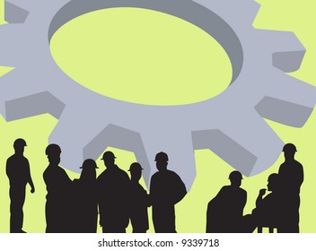 group of men standing near a machine wheel	