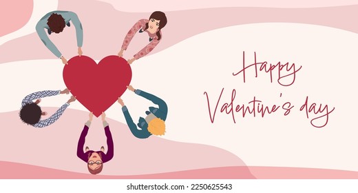 Group of men and women in circle from different culture seen from above holding a heart in their hands. Valentine's Day party concept. Copy space banners. Poster template pink background