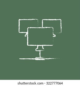 Group of monitors hand drawn in chalk on a blackboard vector white icon isolated on a green background.