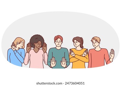 Group of multiethnic people show stop gestures not wanting to accept discrimination. Multi-ethnic coalition of staff or students express negative emotions and protest against unacceptable actions