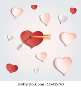 group  of paper hearts, one of that is broken an arrow