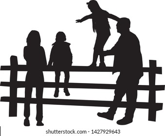 Group of people by fence