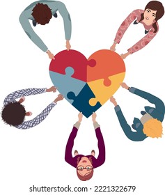 Group of people in circle top view multicultural volunteers holding a heart with puzzle pieces. NGO. Aid. Community of friends or volunteers for help or social assistance. Teamwork