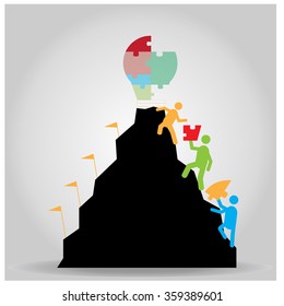group of people reaching a mountain with a lightbulb