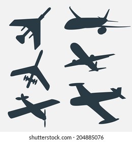 A group of planes in all different angles. Airplane silhouettes