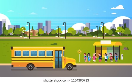 Group pupils children waiting yellow school bus station transport concept on cityscape background flat horizontal vector illustration