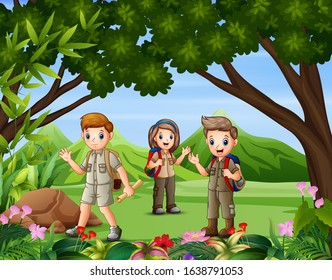A group of scouts hiking in the forest