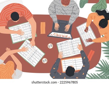 Group of students at the table are studying. Top view.