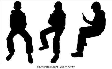 A group of teenagers is texting on a phone. Silhouette of a schoolboy with a cell phone. A young man with a mobile phone in his hand. The teenager is sitting. A set of black silhouettes are isolated	