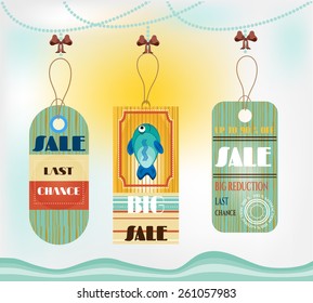 Group of three hanging tags with patterns and fish