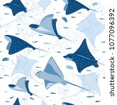 Group of various rays gracefully gliding through the ocean