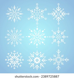 Group of white snowflakes for winter, spring and Christmas elements on isolated blue background, white geometric minimalist snowflake elements and icons concept design