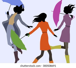 Group of women in autumn with umbrellas