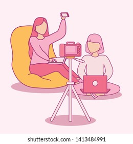 group women using laptop with photographic camera
