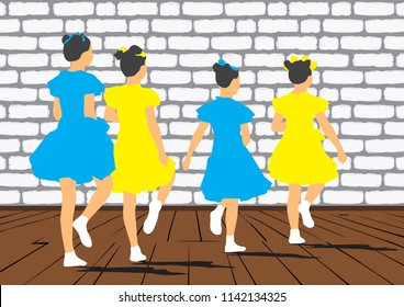 A group of young girls dancing synchronously