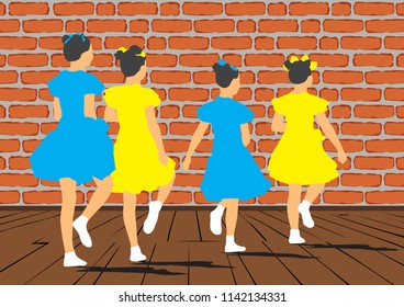 A group of young girls dancing synchronously