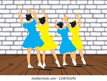 A group of young girls dancing synchronously