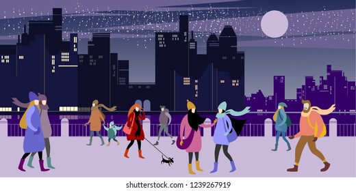 A group of young urban warmly dressed  people walk in the evening winter city quay