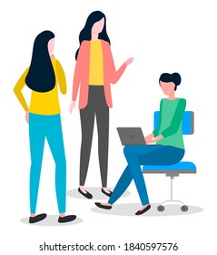 Group of young women. Girl sits in office chair on castor, works on laptop. Female boss stands in jacket and dictates or orders. Girl, back view, stands and ponders. Office workers are planning