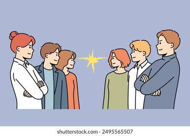 Groups of competing office workers look at each other demonstrating courage and readiness to fight. Competing business men and women seeking to demonstrate superiority over colleagues