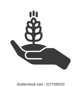 Growing cereal with earth in hand icon isolated on white background.Vector illustration.