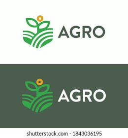 Planta de cultivo en la finca de campo verde bajo el logotipo agrícola solar