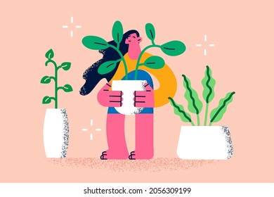 Growing plants and home flowers concept. Young smiling woman cartoon character standing holding green blooming flowers house plants in pots vector illustration