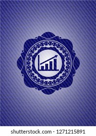 growth chart icon inside emblem with denim texture