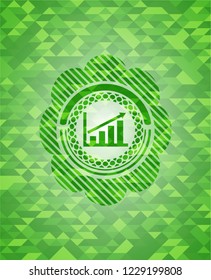 growth chart icon inside green emblem with triangle mosaic background