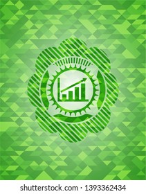 growth chart icon inside green mosaic emblem