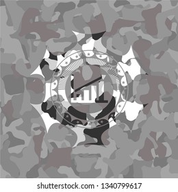 growth chart icon inside grey camouflaged emblem